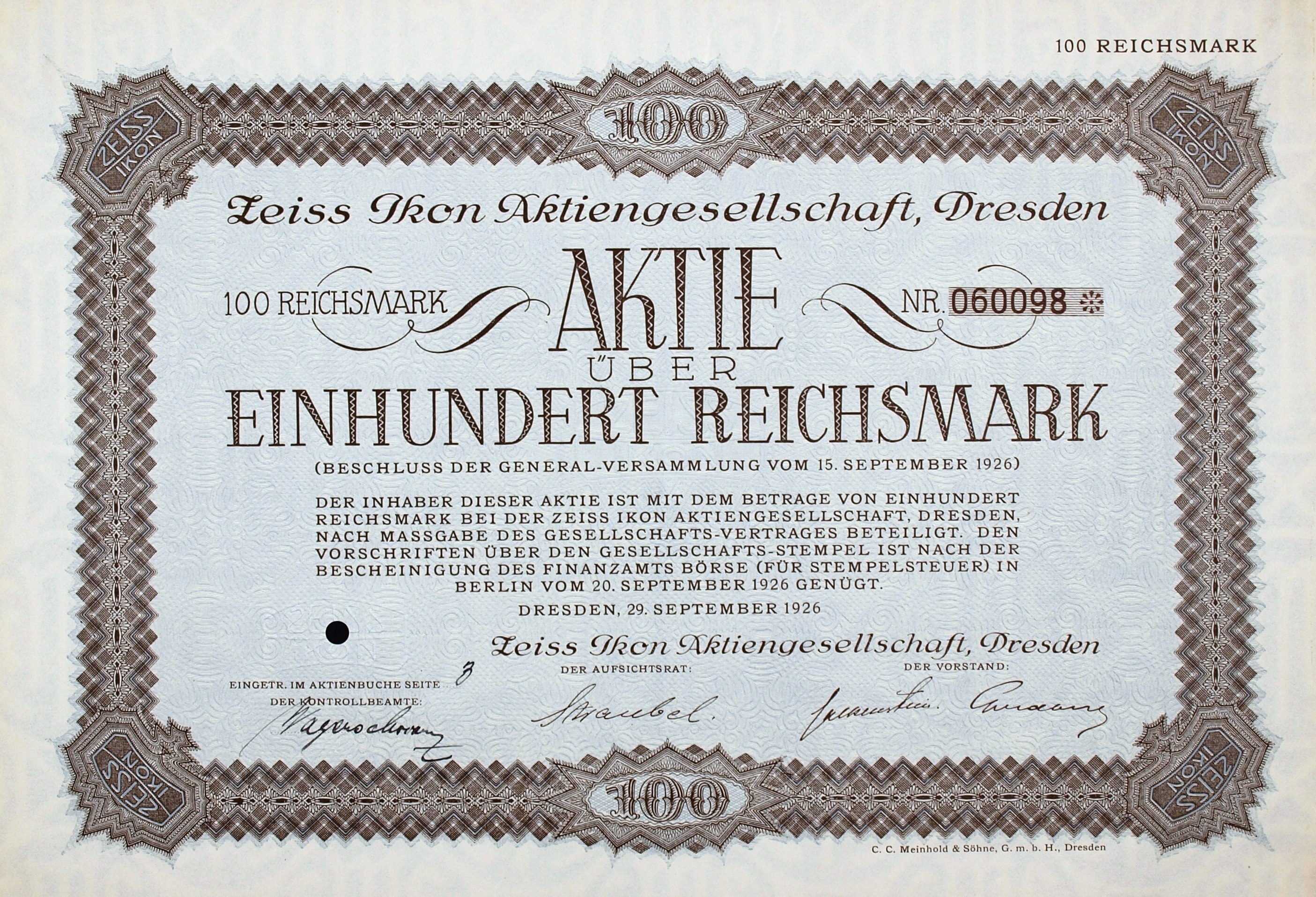 Alter deutscher Aktienchein für 100 Reichsmark mit schwarzem Rand und gedrucktem Text.