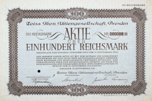 Alter deutscher Aktienchein für 100 Reichsmark mit schwarzem Rand und gedrucktem Text.