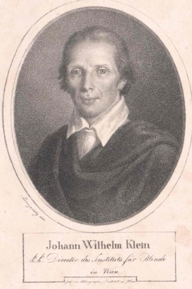 Schwarz-weiß-Porträt von Johann Wilhelm Klein, Direktor des Instituts für Blinde in Wien, der einen weißen Hemd trägt und einen ernsten Gesichtsausdruck hat.